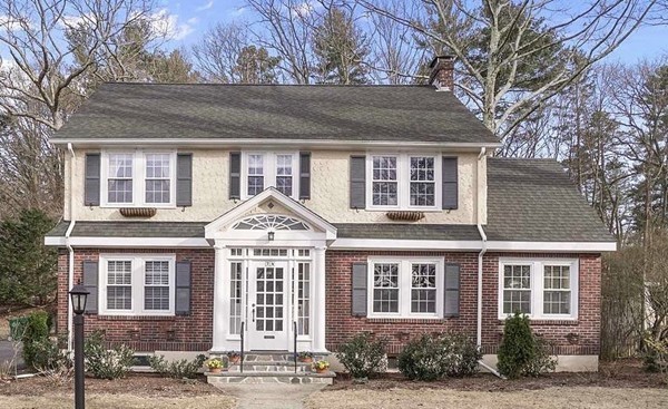 Exterior of 4-bedroom colonial at 74 Park Lane, Newton, MA with brick and stucco facade