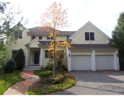 Front exterior of 6-bed home at 820 Newton Street in Brookline with triple garage