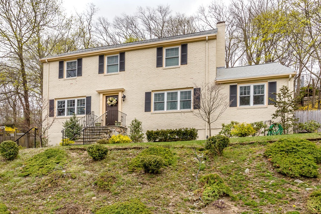 Front exterior of 4-bedroom colonial home at 10 Travis Drive in Newton, MA